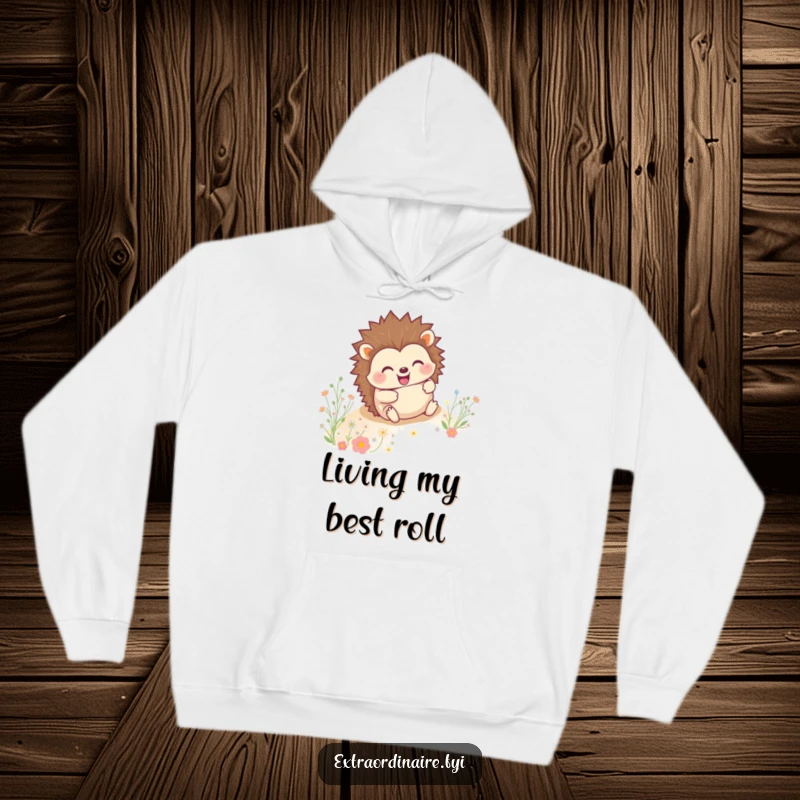 Cozy hoodie featuring a grinning hedgehog rolling downhill through flowers, radiating happiness and warmth.