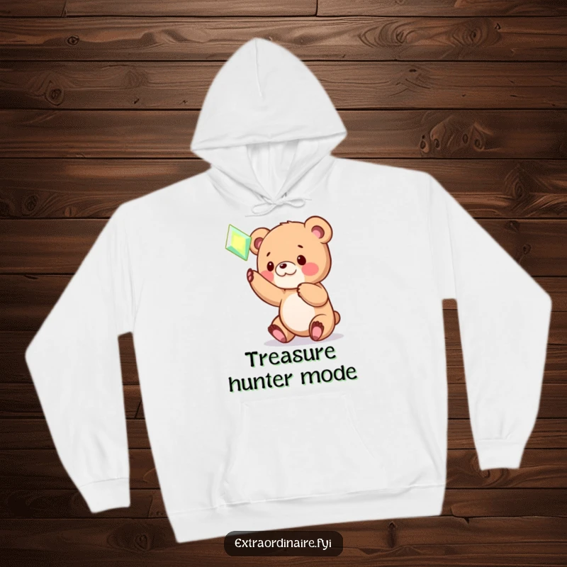 Funny Bear Cub Gem Hoodie: A warm hoodie featuring a funny illustration of a playful bear cub batting at a magical, glowing hovering gem.